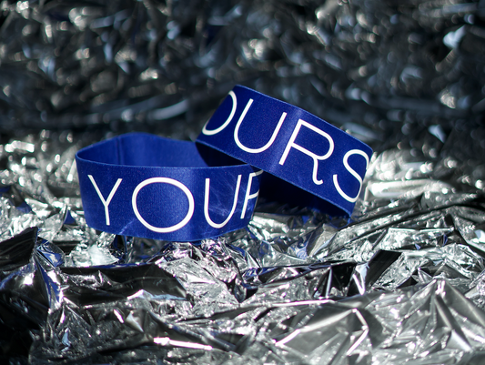 Blue arm bands on top of foil paper