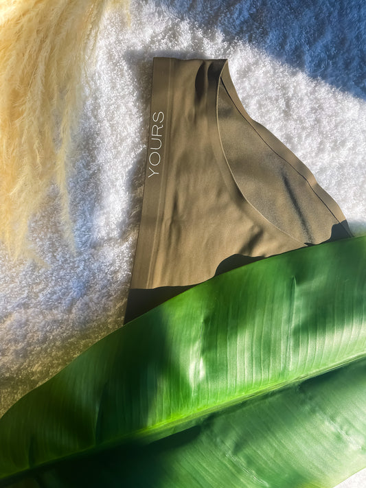 Olive colored Clean Brief on White carpet