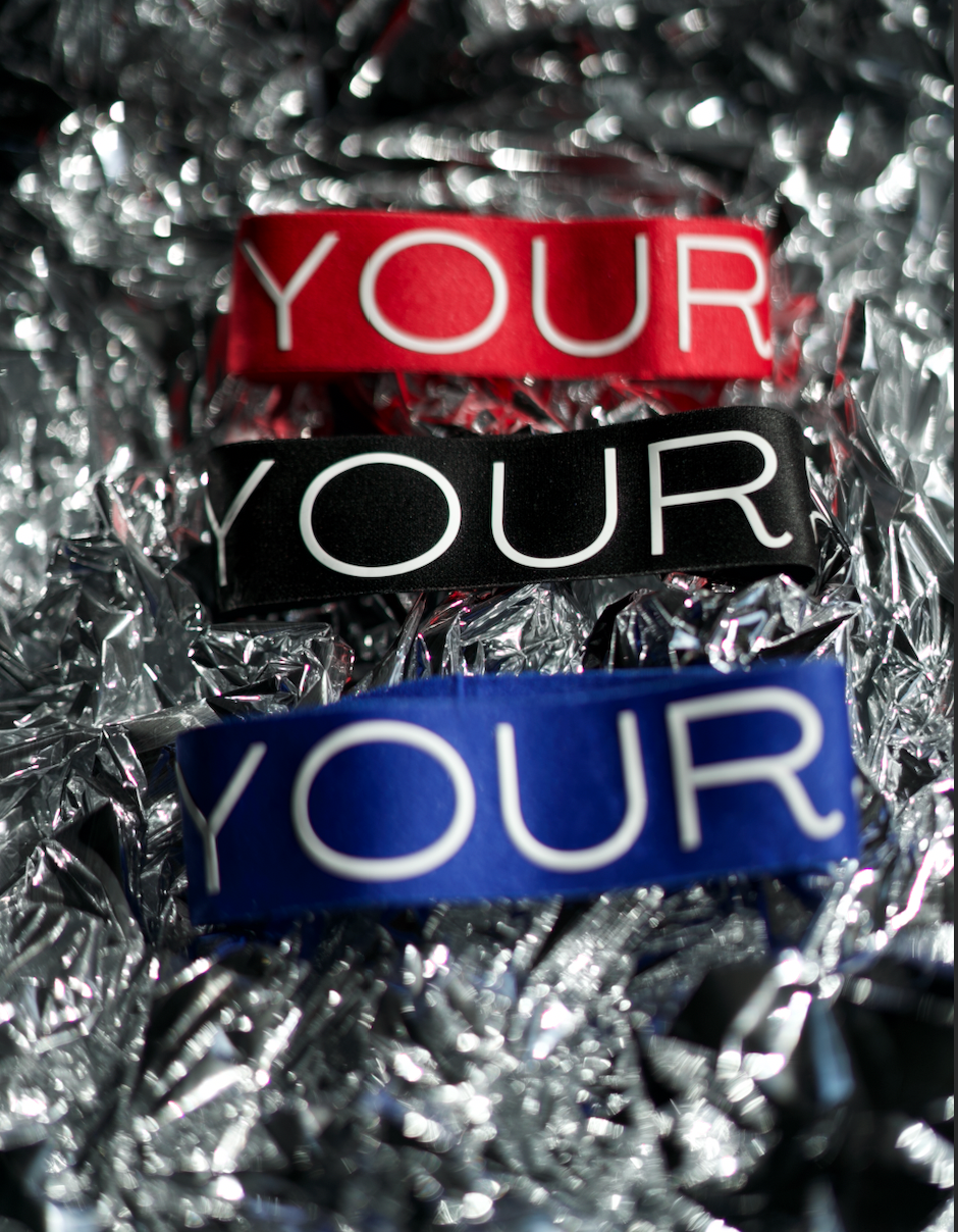 Blue, Black, Red arm bands on top of foil paper