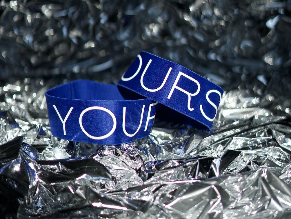 Blue  arm bands on top of foil paper