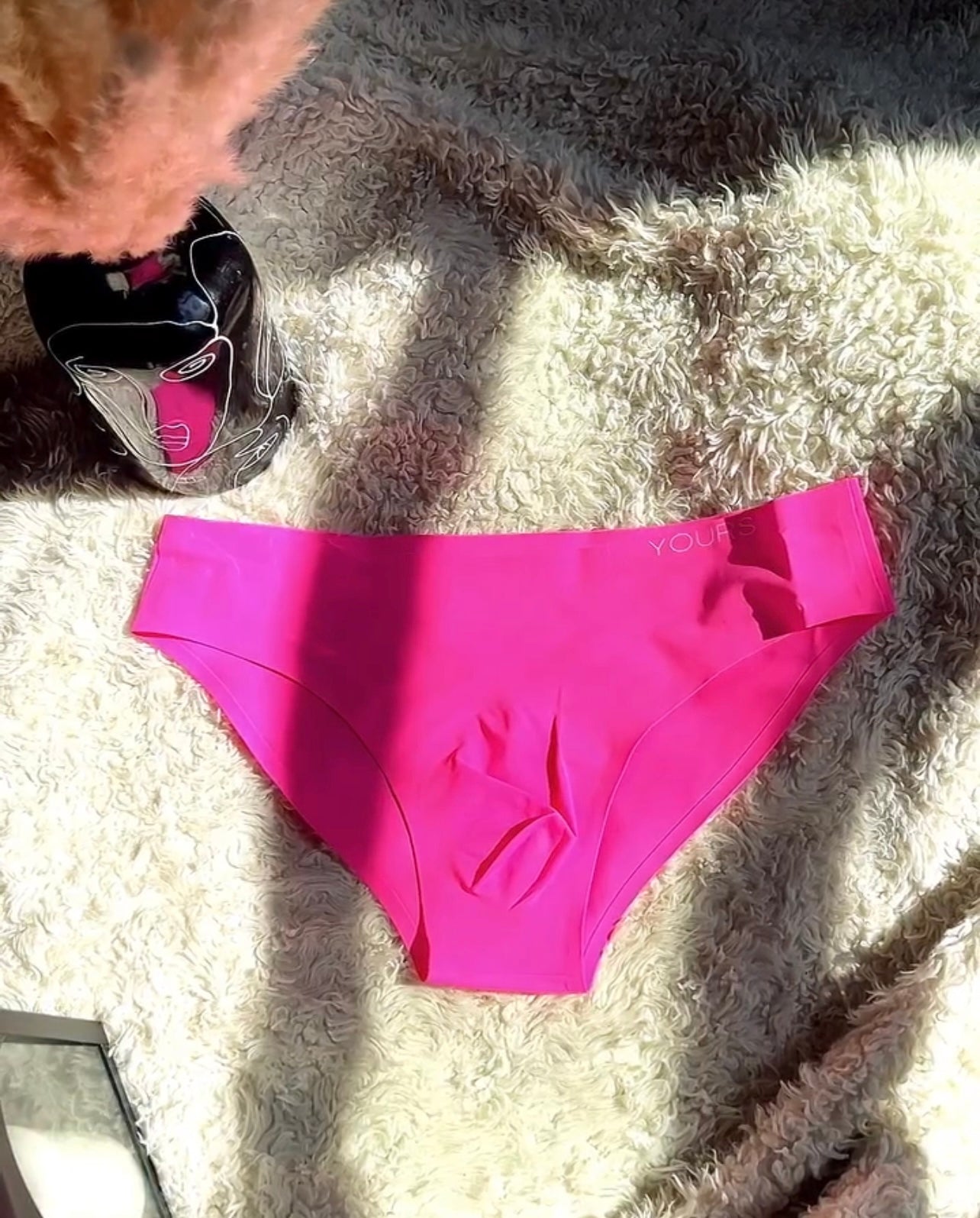 Hot pink colored Clean Brief on white blanket 